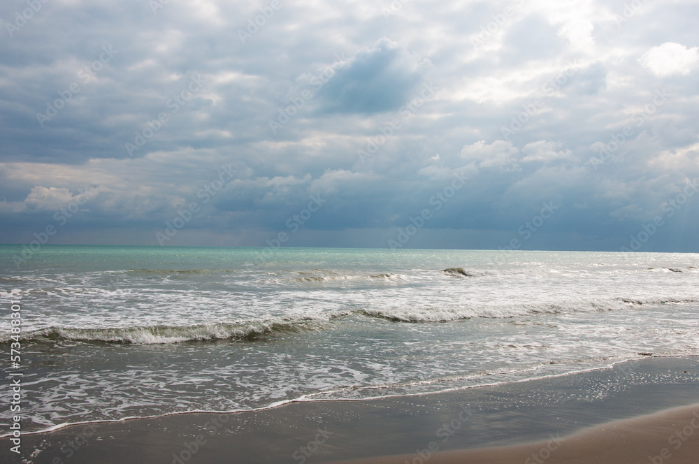 Coast of the Mediterranean Sea in winter. February, Alicante, Spain,waves on the beach Coast of the Mediterranean Sea in winter. February, Alicante, Spain,waves on the beach