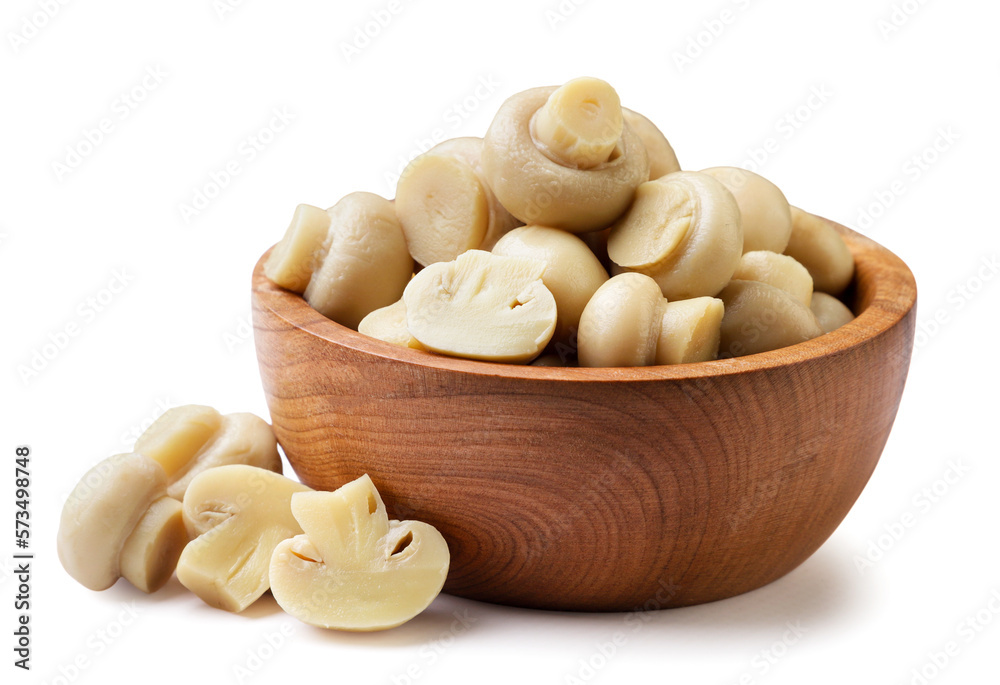 Marinated mushrooms in a wooden plate close-up on a white background. Isolated Marinated mushrooms in a wooden plate close-up on a white background. Isolated