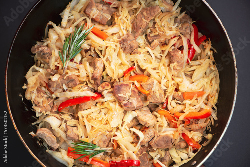 stewed cabbage with meat in a pan