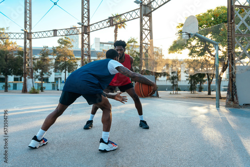 Young basketball players training at the court.
