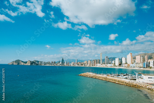 Panorama of Benidorm city with Mediterranean sea, Benidorm skyscrapers, hotels and mountains in the background