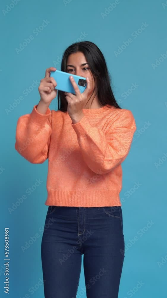 woman with smartphone playing videogames. Vertical video. woman with smartphone playing videogames. Vertical video.