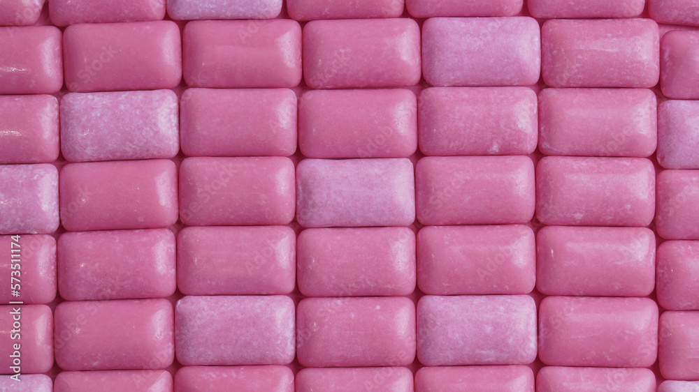 Many pink chewing gums as background, top view