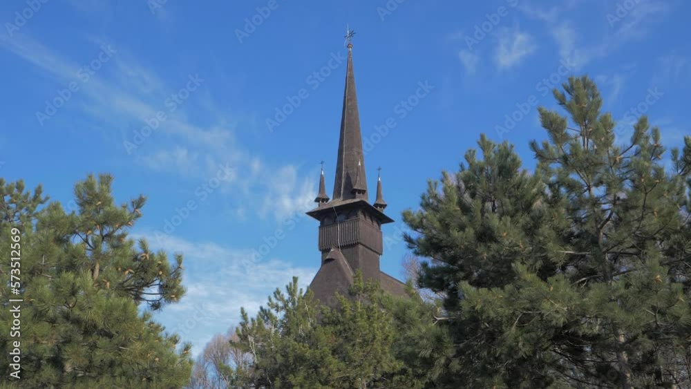 Great Martyr Mina Church, Constanta, Romania, impressive tower measuring 43 m in height of the austere wooden black church built in the traditional style of the area of Maramures Great Martyr Mina Church, Constanta, Romania, impressive tower measuring 43 m in height of the austere wooden black church built in the traditional style of the area of Maramures