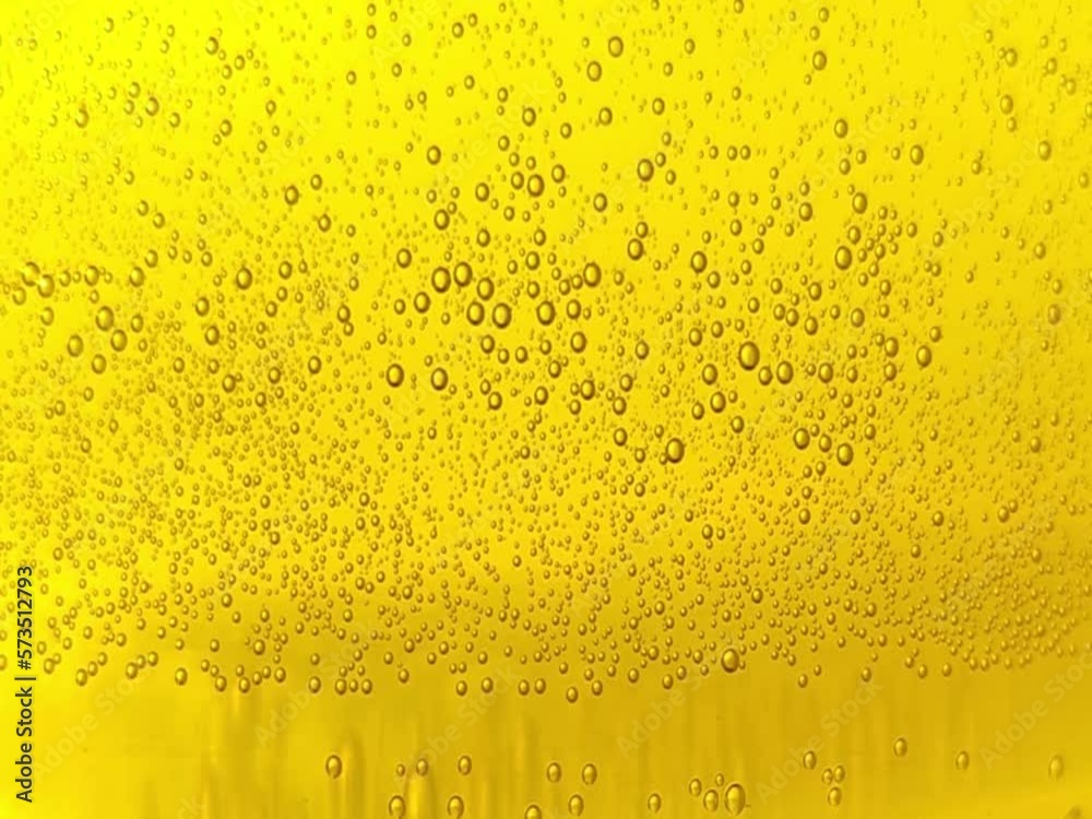 yellow carbonated drink beer small bubbles texture lemon juice cider sparkling soda water abstract background video