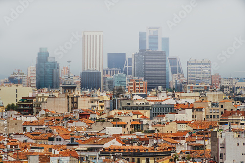 View of the center of Madrid with the high buildings of the Financial Center in the background, in a morning of fog.
