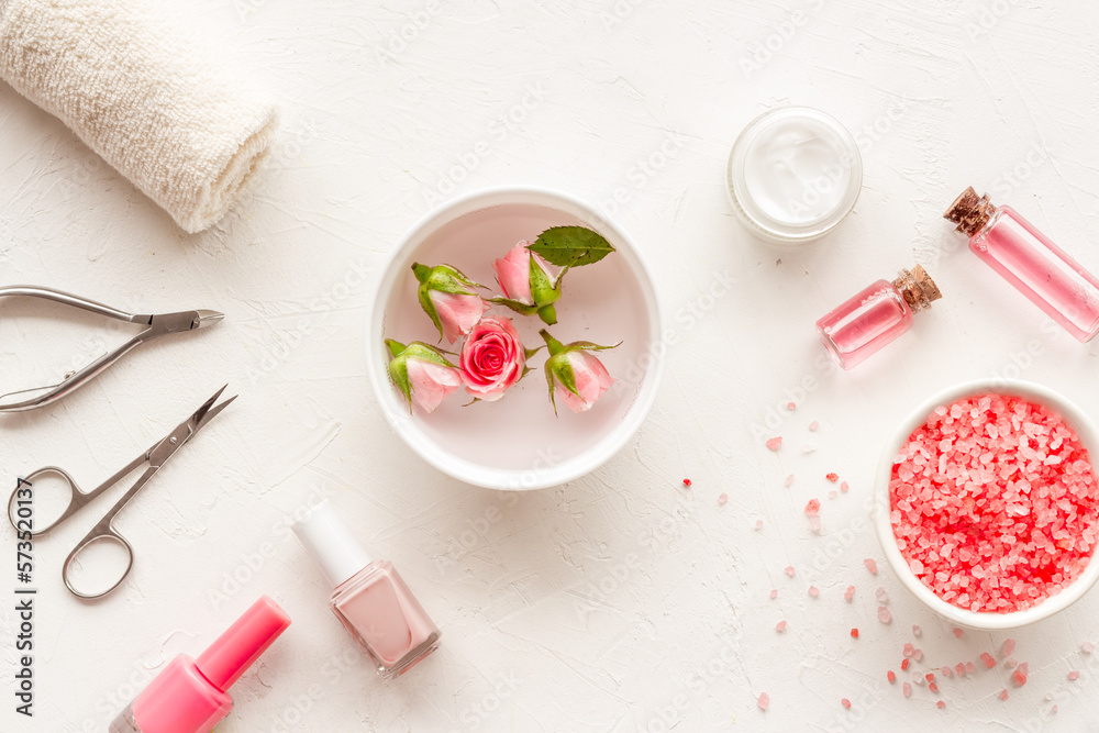 Manicure scissor and hands care cosmetics set with flowers. Manicure scissor and hands care cosmetics set with flowers.