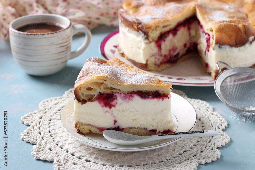 Karpatka with cherries, traditional Polish cream pie on light blue background. Horizontal format Karpatka with cherries, traditional Polish cream pie on light blue background. Horizontal format