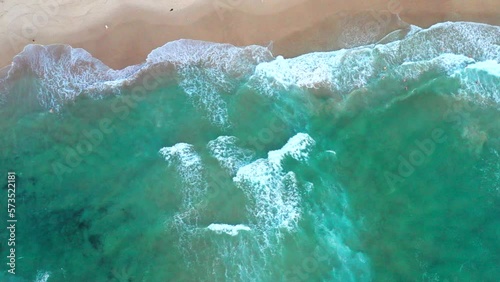 Moving to the left aerial top down drone shot of the beach and ocean riptide currents at Bondi beach Australia photo