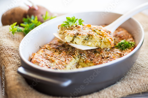 potato casserole with cabbage and spices in a ceramic form