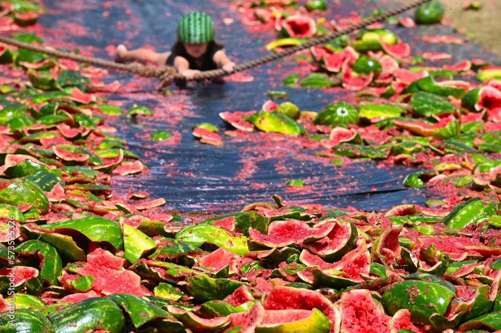 Unrecognizable person watermelon skiing at The Chinchilla Melon Festival