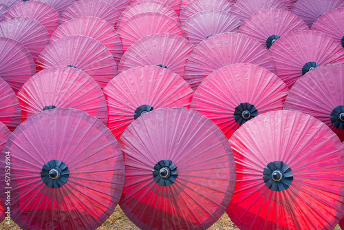 Beautiful red color of paper umbrella Traditional handmade umbrella a product that is unique and popular as a souvenir for tourists in travel of Chiang Mai  Northern Thailand.