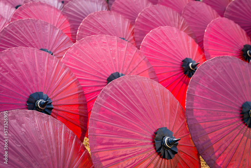 Beautiful red color of paper umbrella Traditional handmade umbrella a product that is unique and popular as a souvenir for tourists in travel of Chiang Mai  Northern Thailand.