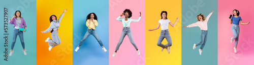 Overjoyed Multiethnic Ladies Jumping In Air Over Bright Studio Backgrounds