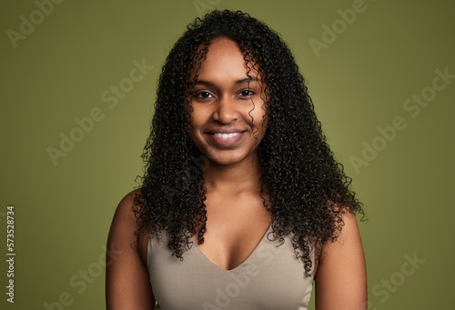 Smiling ethnic woman looking at camera