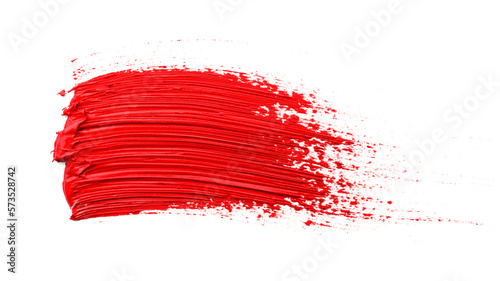 Red oil paint stroke on white background, top view