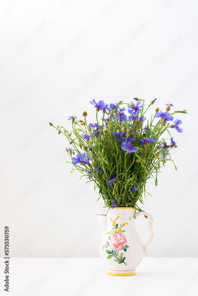 Beautiful summer Centaurea triumfettii flowers in a vase, part of home interior Beautiful summer Centaurea triumfettii flowers in a vase, part of home interior