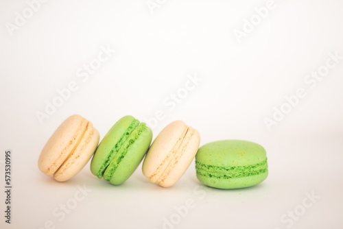 white and green macaroons isolated on white background, free copy space
