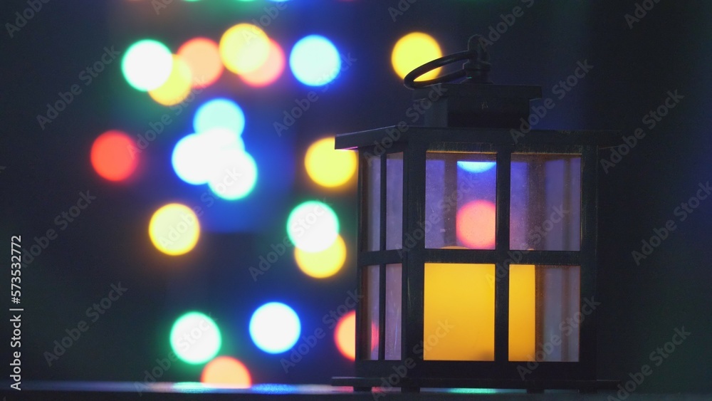 Candle lamp and colorful lights of Christmas night Candle lamp and colorful lights of Christmas night