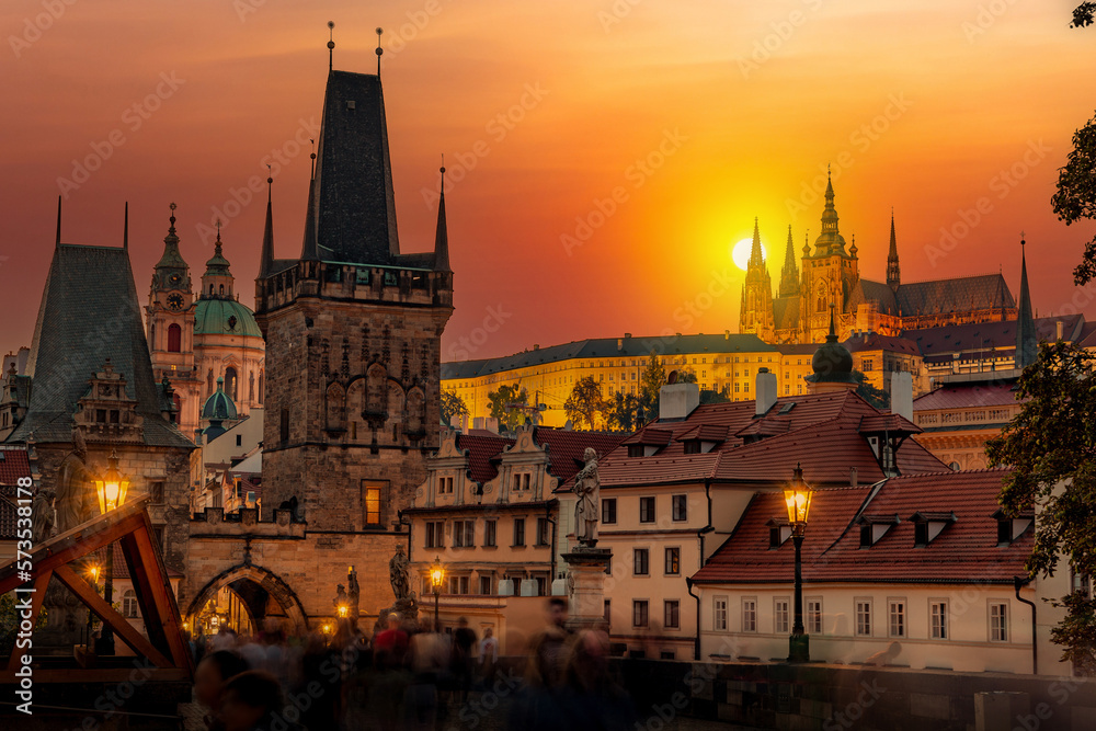 Prague with Old Town Bridge Tower and Charles bridge over Vltava river at sunset, Czechia