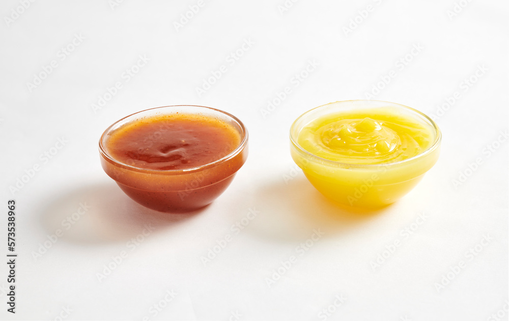 chilli sauce and yellow mustard isolated on white background chilli sauce and yellow mustard isolated on white background