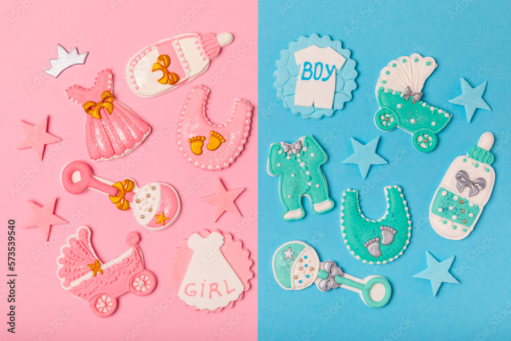 Boy or girl? Gender party. Gender cookies. Baby shower cookies on a vibrant pink and blue background. Candy bar holiday baby shower party. Holiday concept. Boy or girl? Gender party. Gender cookies. Baby shower cookies on a vibrant pink and blue background. Candy bar holiday baby shower party. Holiday concept.