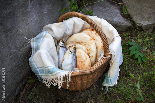 Five loaves and two fish in basket photo