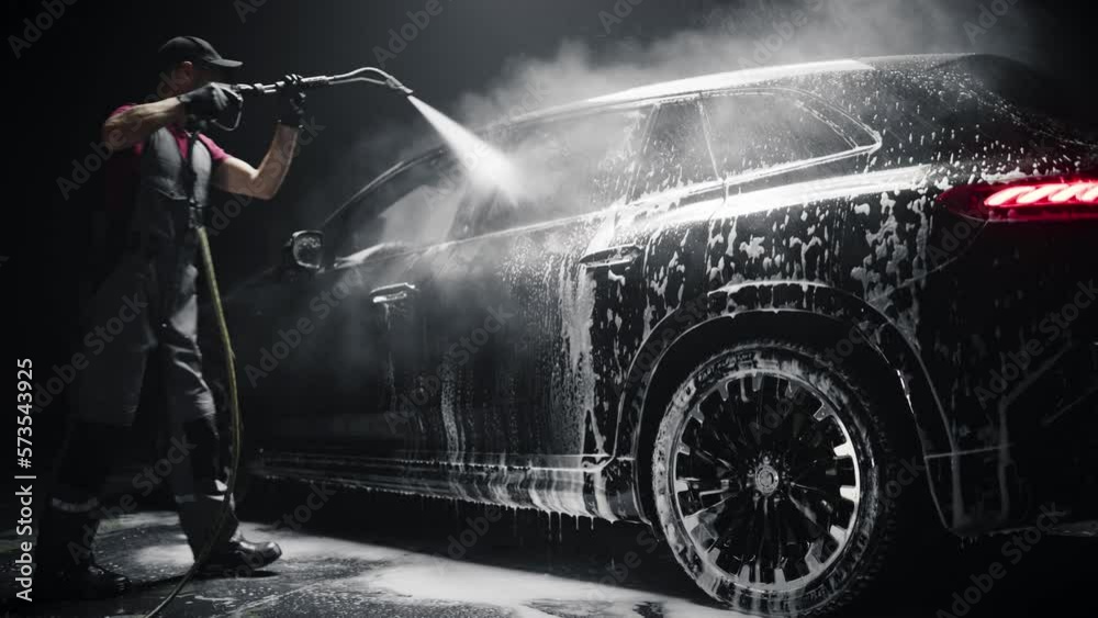 Brand New Electric Vehicle from a Production Line is Being Rinsed From ...