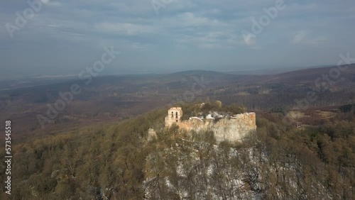 Drone is flying towards the ruins of Pajstun Castle on a cliff, Slovakia, 4k photo