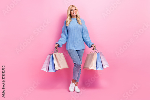 Full length photo of lovely positive glad lady wear trendy clothes buy low prices outit new boutique isolated on pink color background