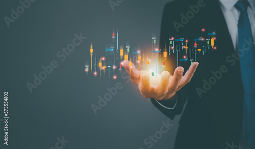 2023 business finance technology and fund investment concept,bonds,gold, global currency,stock marketdigital assets Businessman analyzing forex trading chart..financial information before the capital