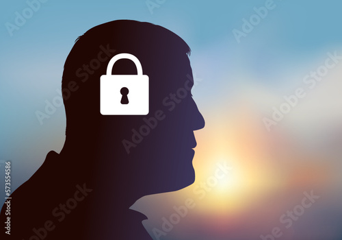 Concept de la souffrance psychique et des maladies mentales avec le symbole d’un homme dont le cerveau est fermé par un cadenas.