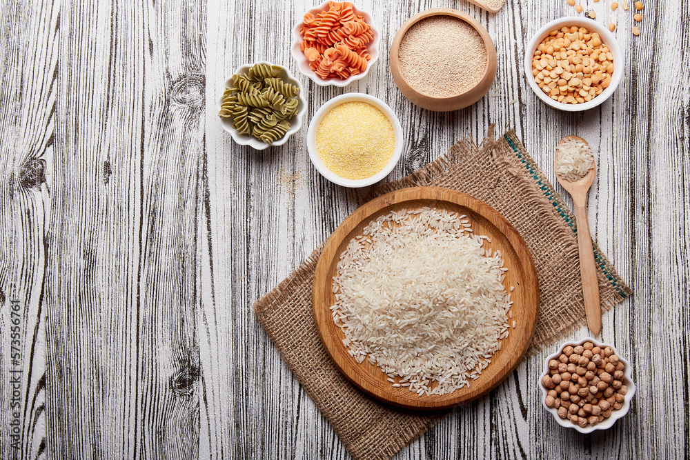 Assortment of gluten-free pasta and cereals amaranth, peas, chickpeas, corn porridge. FODMAP, keto diet, long carb concept with copy space Assortment of gluten-free pasta and cereals amaranth, peas, chickpeas, corn porridge. FODMAP, keto diet, long carb concept with copy space