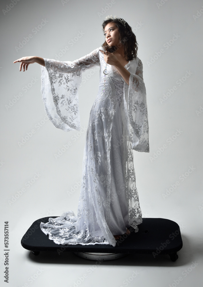 Full length portrait of beautiful woman wearing fantasy costume, white ...