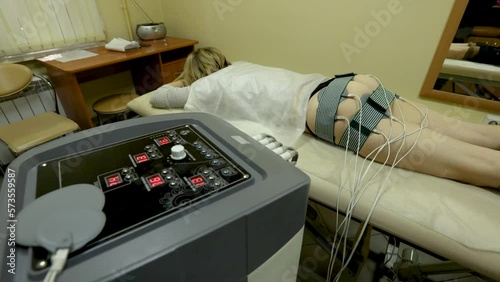 The operation of the device for myostimulation. control buttons. photo