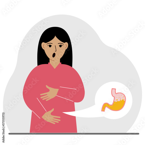 The concept of pain in the abdomen. The woman holds his stomach with both hands. Problems with the stomach or digestion.