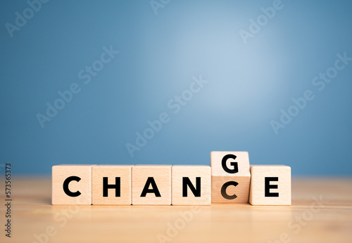 Flipping wooden cube block for "Change" to " Chance " wording. Concept of Economy investment business witch crisis and technology transformation to make good chance.