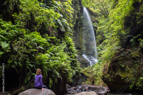 A young woman in Tilos waterfall, La Palma Island, Canary Islands. photo