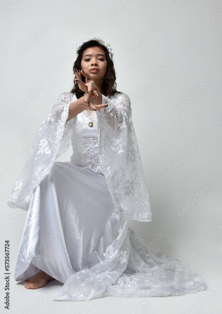 Full length portrait of beautiful woman wearing fantasy costume, white ...