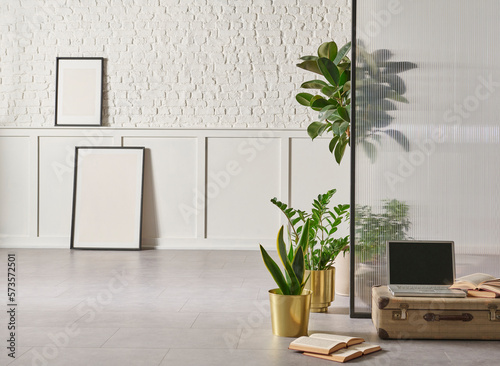 Modern home furniture design, gold vase of plant, retro old baggage and laptop style, white brick and classic wall background frame.