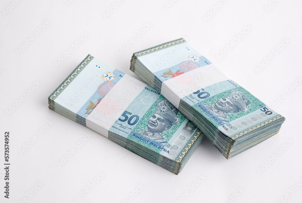 Malaysia Currency Ringgit 50: Stack of Ringgit Malaysia bank note on white background Malaysia Currency Ringgit 50: Stack of Ringgit Malaysia bank note on white background