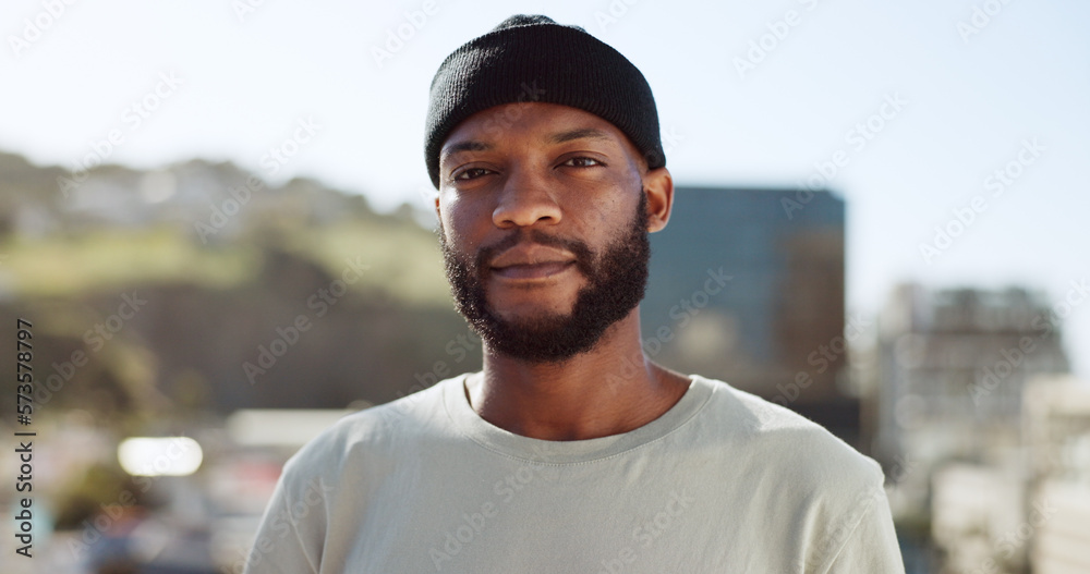 © Siphosethu F/peopleimages.com - Face, confident and city with an edgy black man outdoor in an urban town for fashion or street style. Portrait, cityscape and lifestyle with a young African American male outside on a summer day