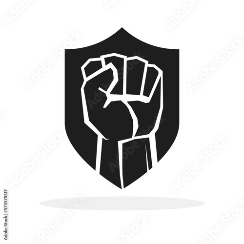 Raised fist symbol. Clenched fist symbol on a shield. Security or protection logo. Vector illustration.