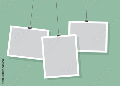Simple hanging photo frames design, light green vector background