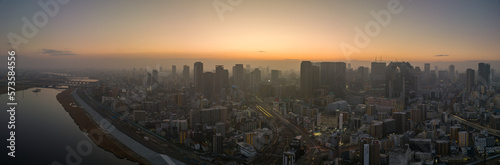 Panoramic aerial view of Yodo River and downtown Osaka before sunrise on misty morning © Osaze