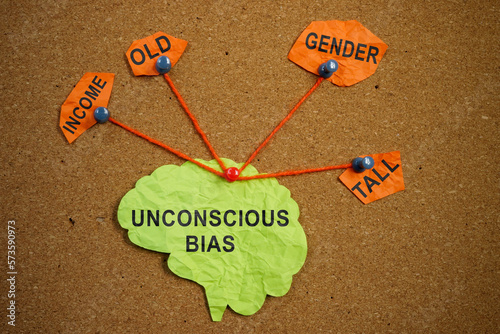 Paper brain pinned pined to the board. Unconscious bias concept. photo