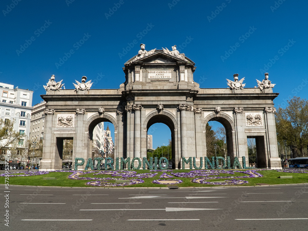 Madrid, Spain. April 6, 2022: Puerta de Alcalá with blue sky.