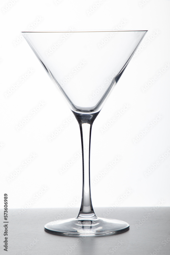 Obraz premium transparent and triangular cup of glass in a white background