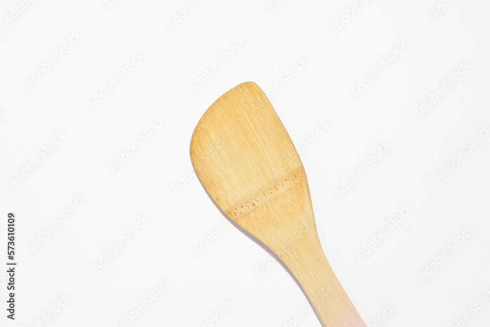 wooden spatula on a white surface wooden spatula on a white surface