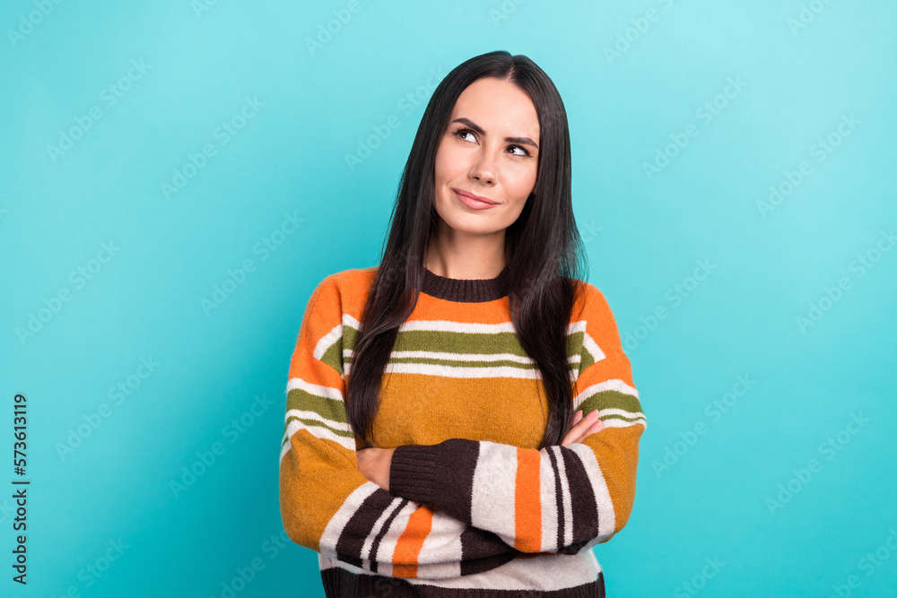 Photo portrait of minded brainstorming young woman folded hands looking empty space suspicious proposition isolated on blue color background Photo portrait of minded brainstorming young woman folded hands looking empty space suspicious proposition isolated on blue color background